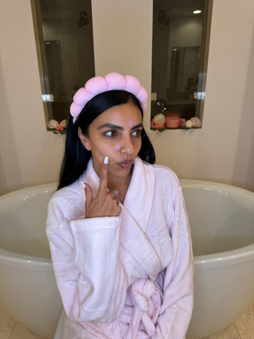Girl with bloomies pimple patches on her face